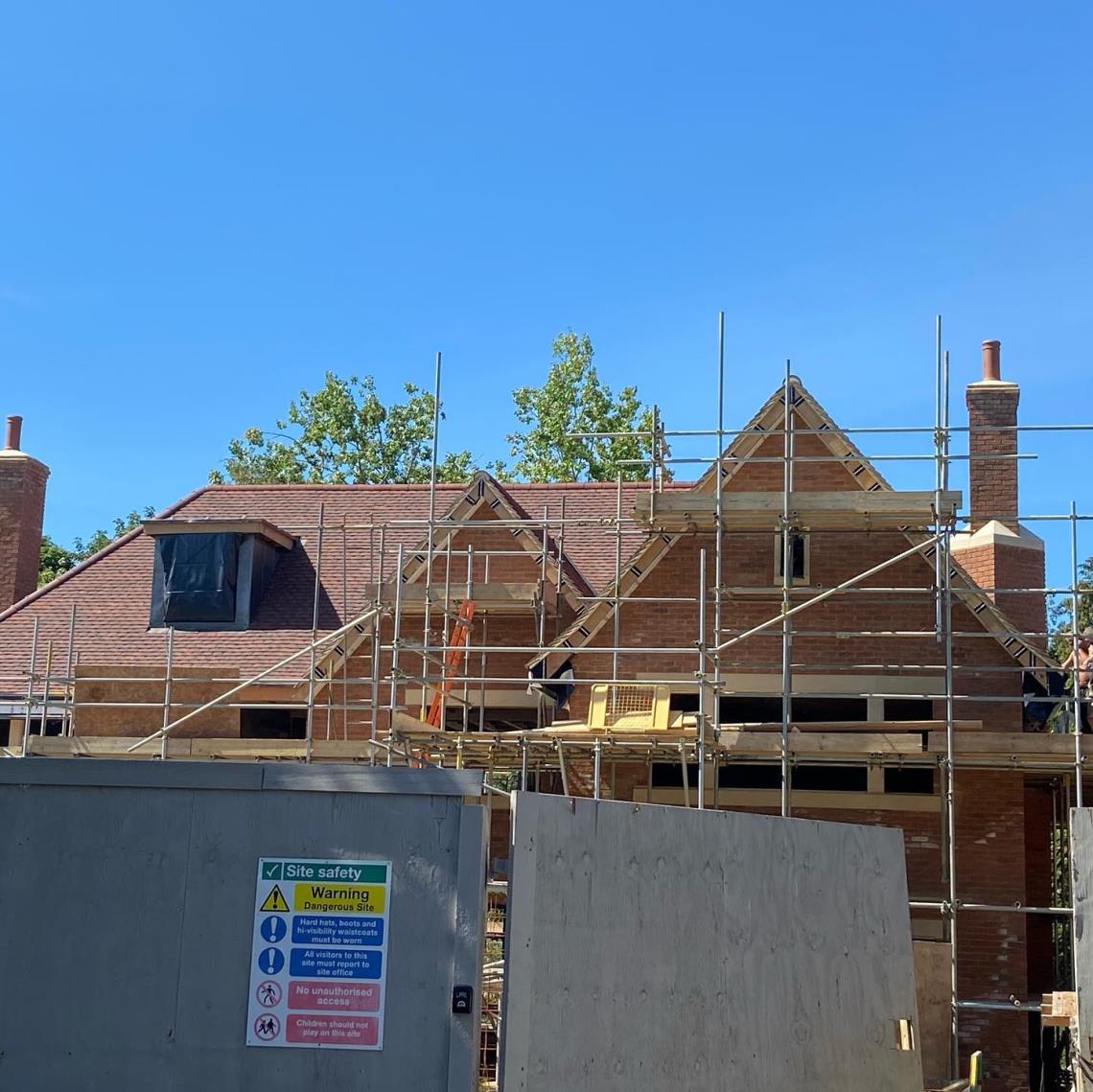 Roof tiling a new build house - By DK Roofing